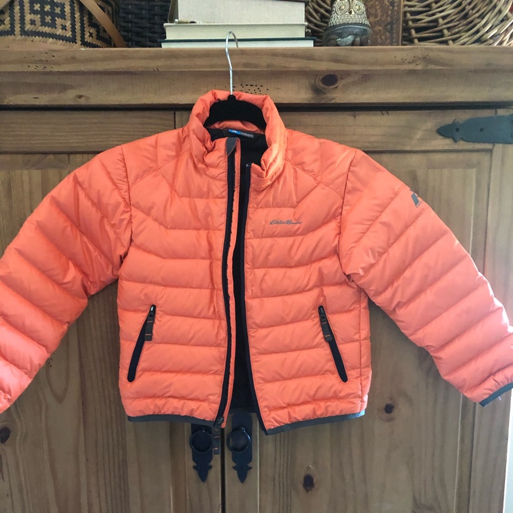 First Ascent orange down filled jacket.